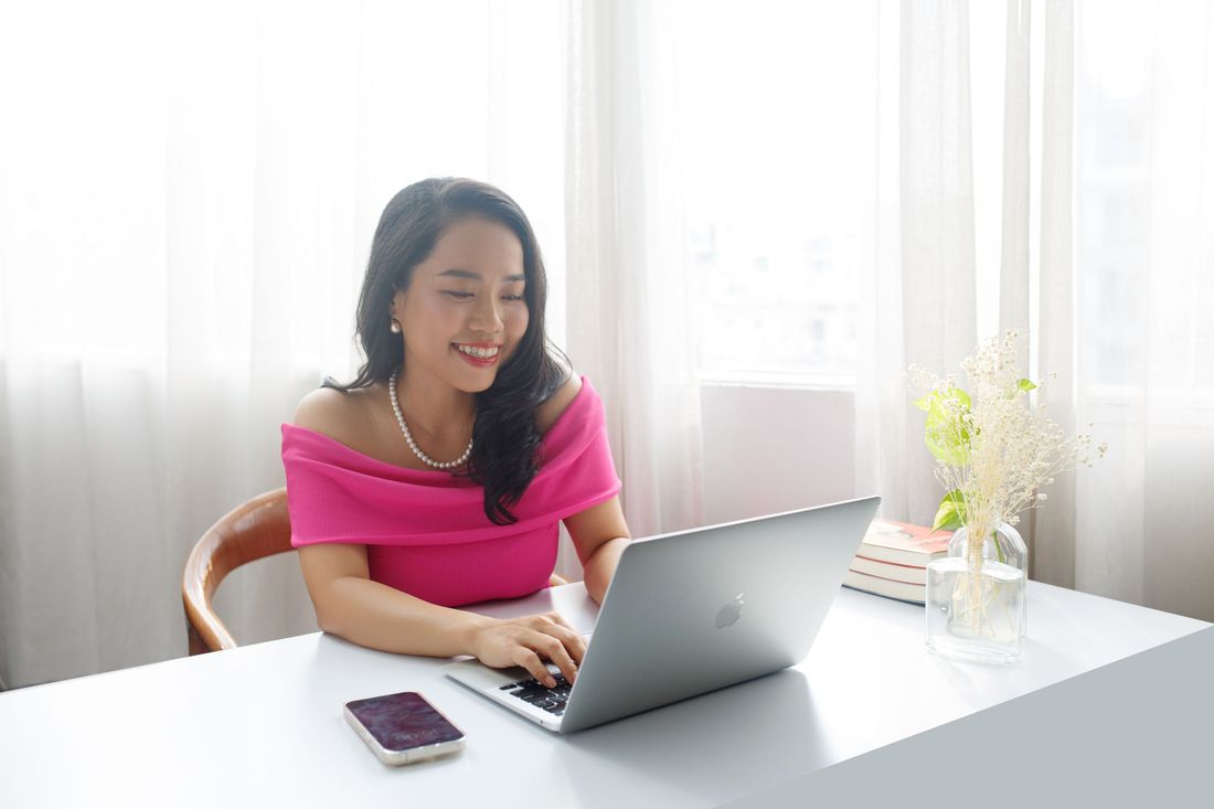 A beauty business owner working on her website
